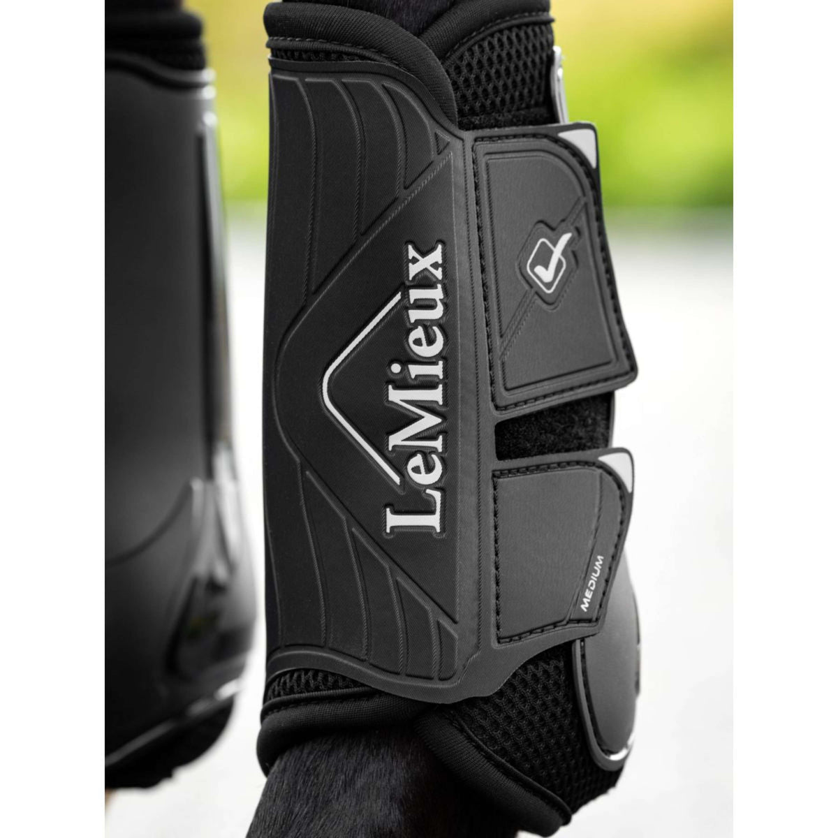 LeMieux Protectores de piernas Motionflex Negro